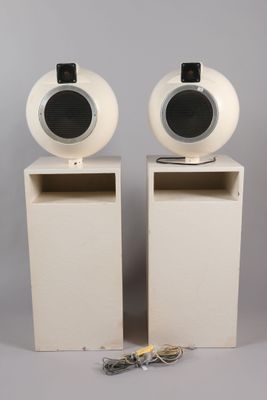 two speakers sitting next to each other on a table