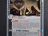 une image d'une carte Pokémon sur laquelle figure un chat