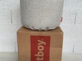 a box that has a pillow on top of it