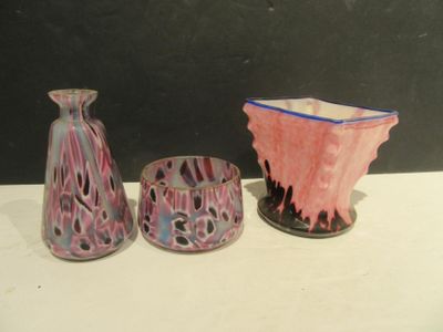 three vases sitting next to each other on a table