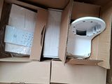 two boxes of electronic devices sitting in a cardboard box