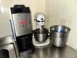 a mixer and a bowl on the counter in the kitchen