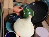 a box full of different types of vases on a table