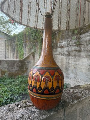 a vase that is sitting on top of a wall