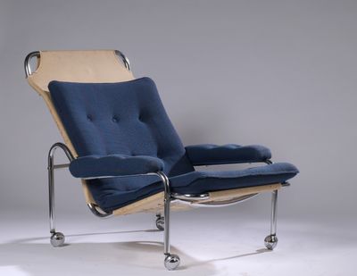 an image of a chair with a blue cushion and chrome legs