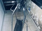 a chair that is sitting in the middle of a dirty kitchen