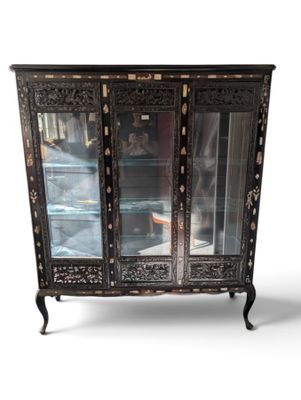 a black cabinet with a glass door on it