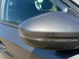 a close up of a car ' s side mirror on the side of the car