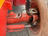 a close up of a tire on a red truck