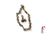 a bird that is sitting on a chain in the shape of a heart