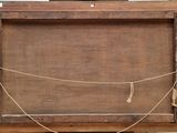 an old wooden box with a rope around it