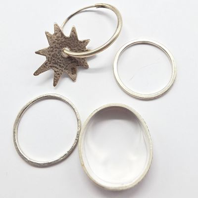 three rings and a ring with a star on top of them