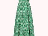 the dress is green and white with a pattern on it