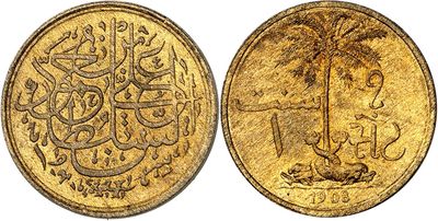 an image of a gold coin with arabic writing on it