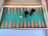 two cups on a tray with a pattern on it
