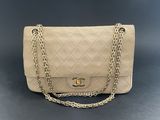 a chanel beige quilted leather shoulder bag with gold chain