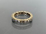 an image of a diamond ring on a table