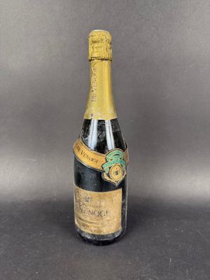 a bottle of champagne with a label on it sitting on a table
