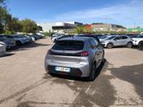 a silver car parked in a parking lot next to other cars