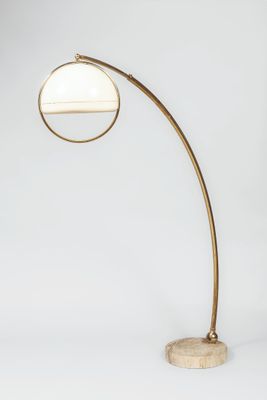 a brass lamp with a marble base and a round glass shade