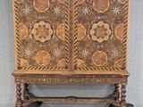 an image of a wooden cabinet with a floral design on it