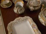 a table with a lot of plates and cups on it