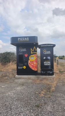two vending machines on the side of the road
