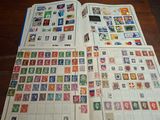 a lot of stamps that are on the table