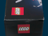 a box that has a lego shark inside of it