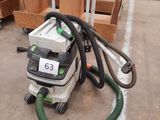 a vacuum that is sitting in the middle of a room