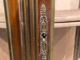 a close up of a wooden door with a metal handle