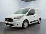 the white van is parked in a large white room