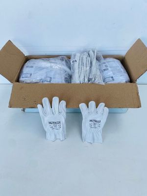 a box filled with gloves and gloves sitting on top of a table
