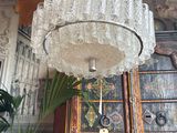 a glass chandelier hanging from a ceiling in a room