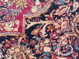 an oriental rug with a red and blue design on it