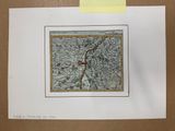 une vieille carte d'une ville sur laquelle figure un point rouge