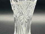 a glass vase that is sitting on a table