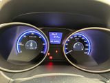the dashboard of a car with a clock and gauges on it