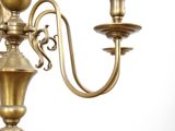 an image of a chandelier with three candles on each of it