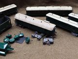 several toy trains are lined up on the floor next to each other