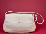 a white purse on a red background