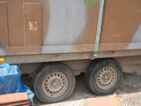 a dump truck that has been vandalized and is parked on the side of the road