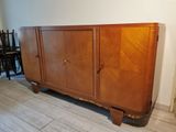 a wooden cabinet that is sitting on a wooden floor
