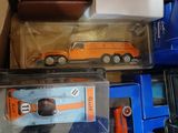 many different types of toy cars in a box
