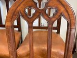 four chairs that are sitting next to each other in a room