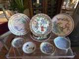 many plates and bowls sitting on a glass table