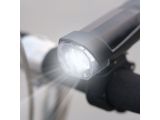 a close up of a light on the handlebar of a bike