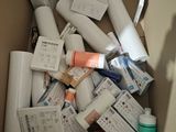 a cardboard box full of toilet paper and other items