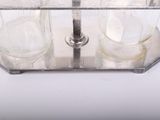 a silver plate with two glasses on it on a table