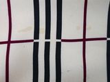 a close up of a black and white checkered shirt